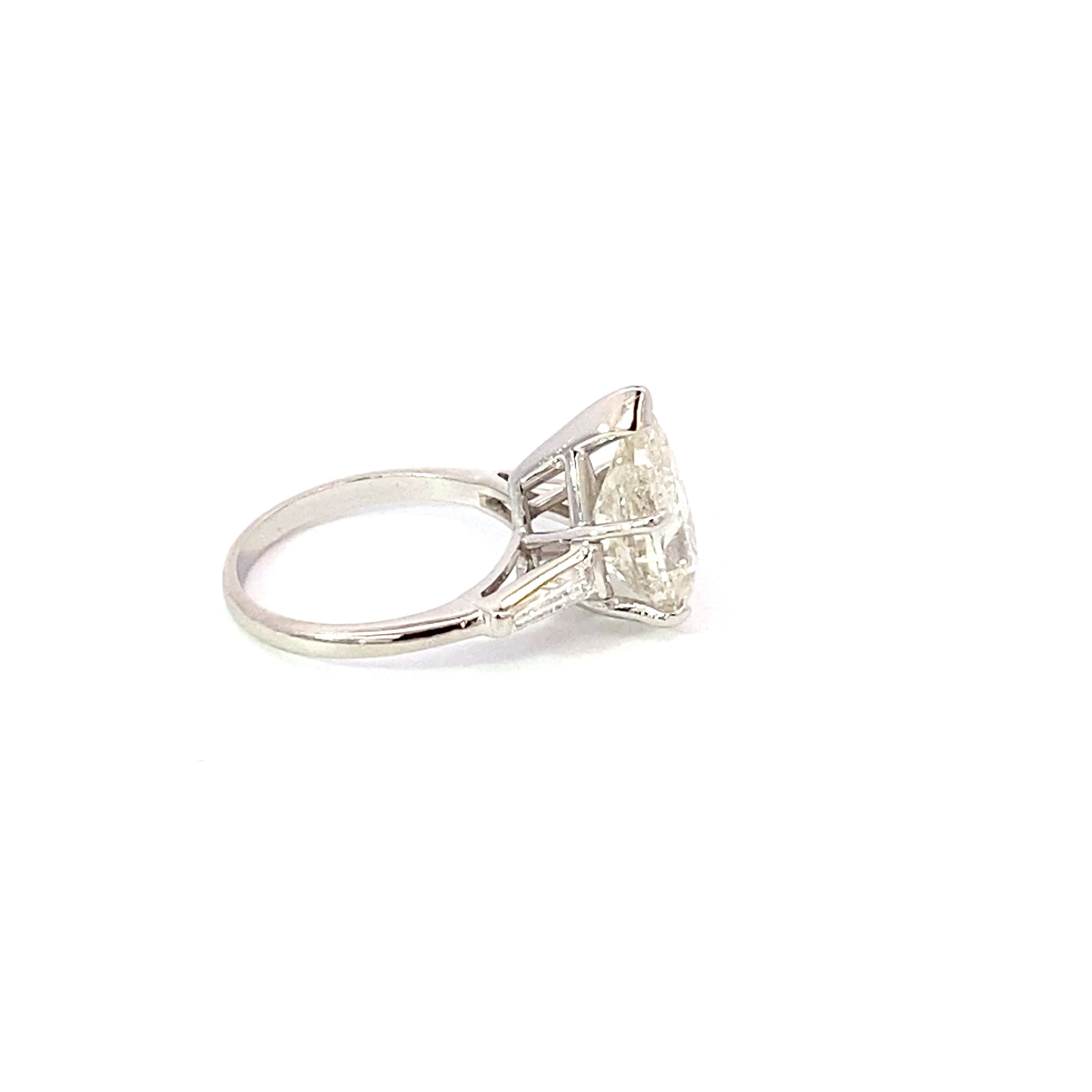 Plat eng ring 4.85cts Pear Sha