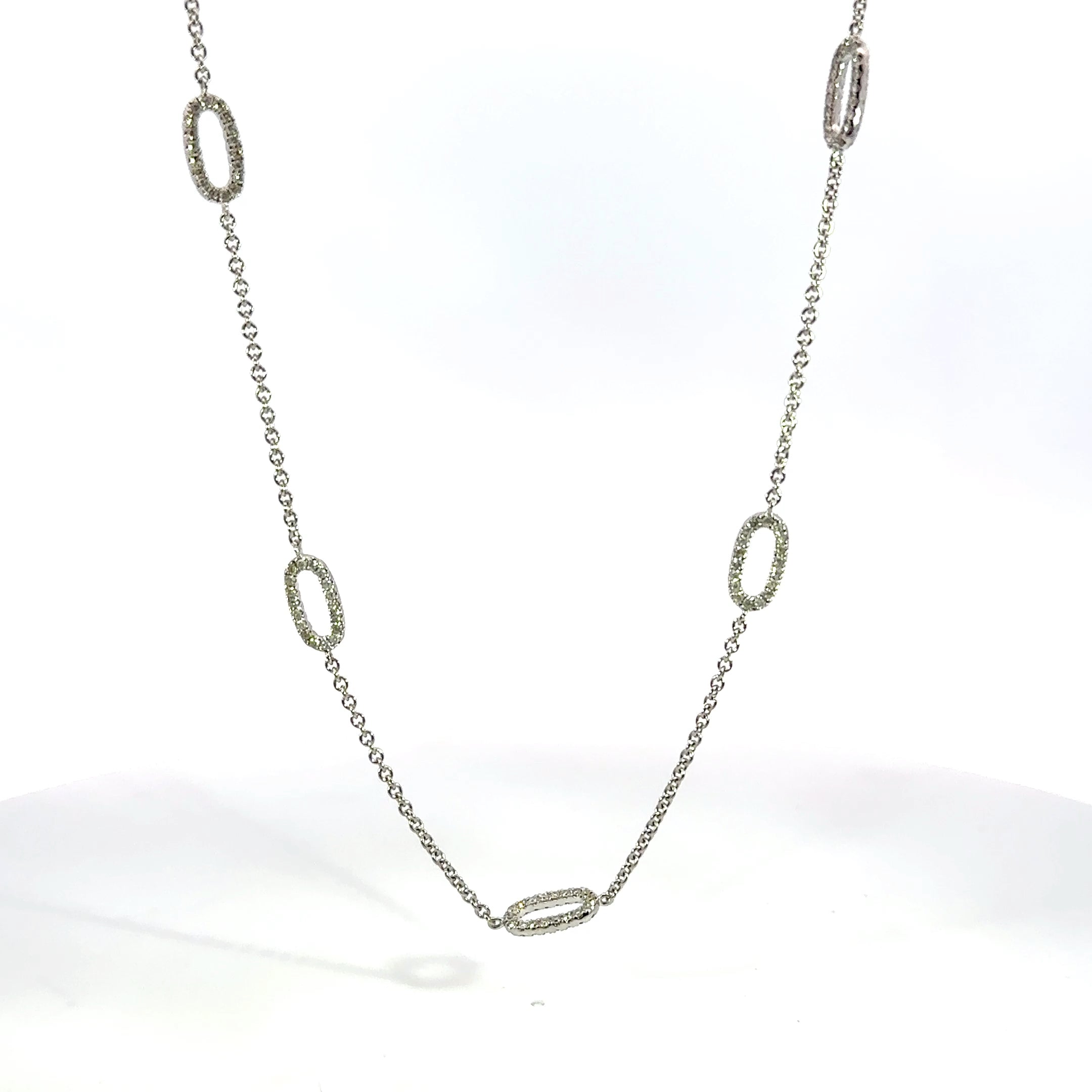 18kt wg dia flat oval link nec