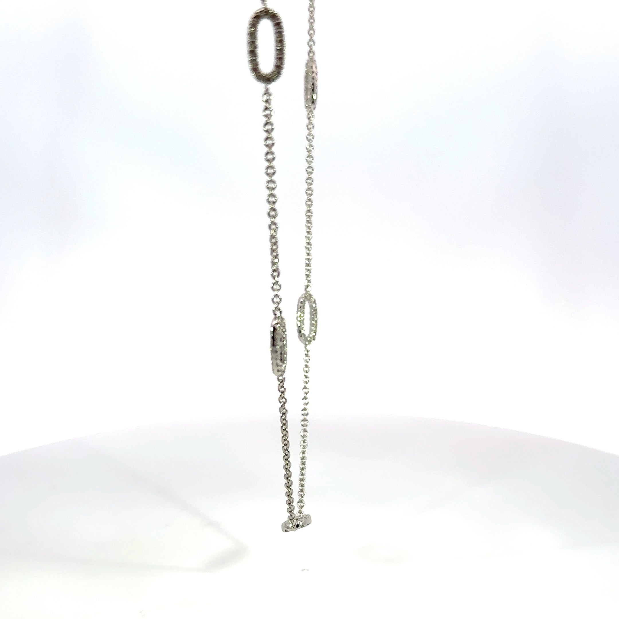 18kt wg dia flat oval link nec