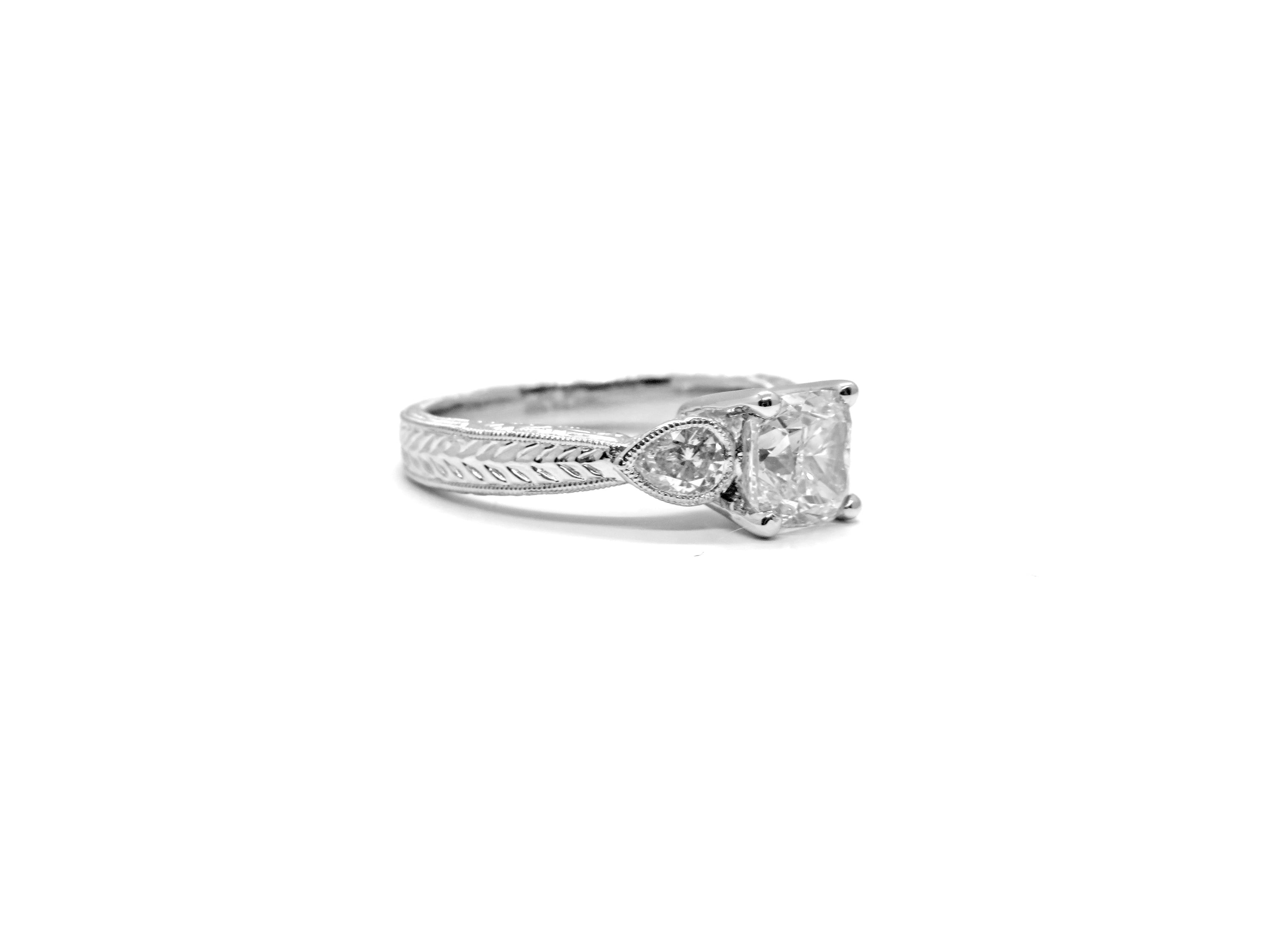 Platinum Engagement Ring with 1ct Round Brilliant Cut and Two Pear Shape Diamonds
