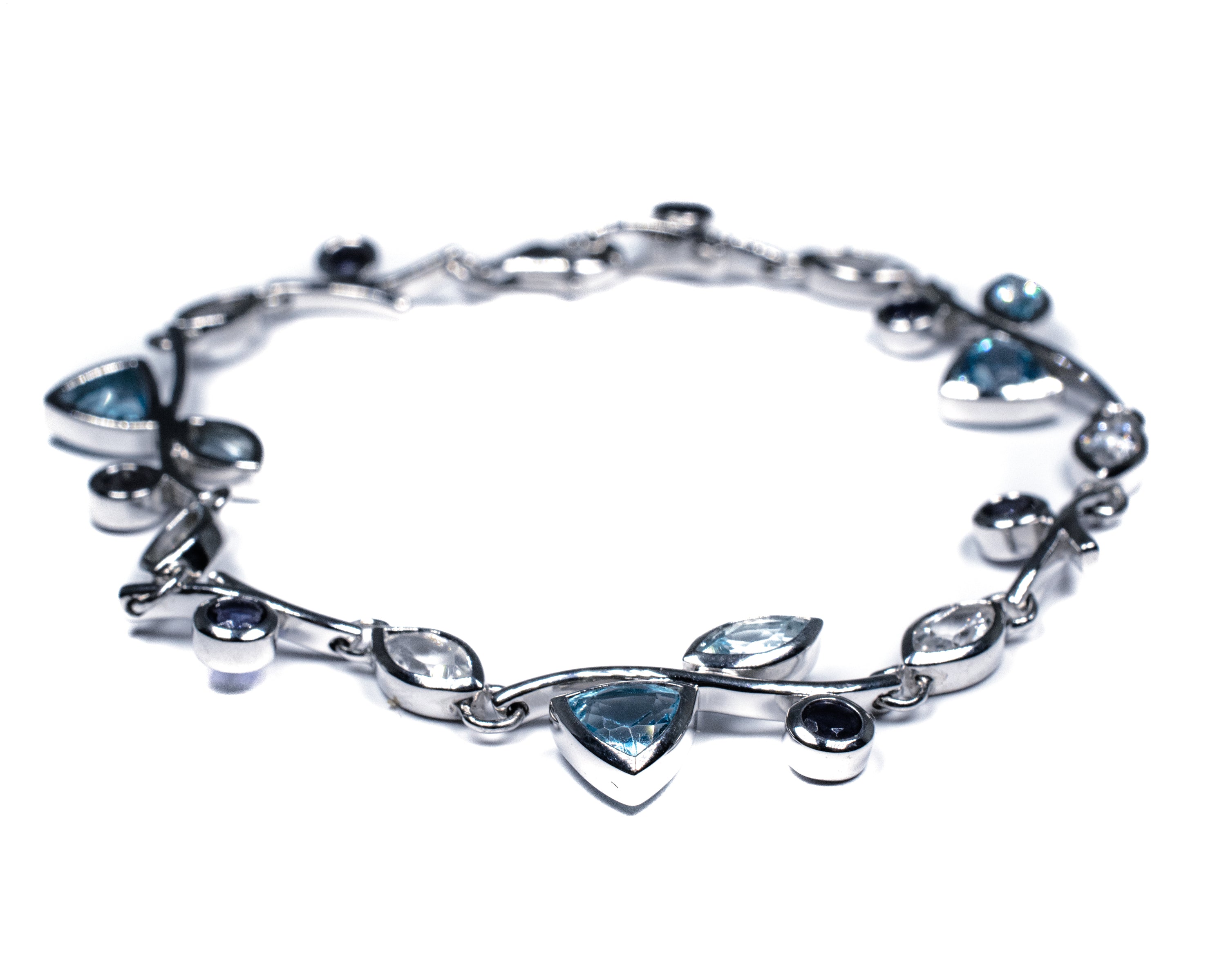 Silver Floral Bracelet with Blue Topaz, White Topaz & Lolite – Petal Design